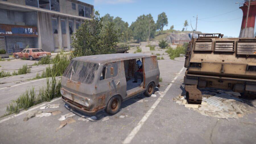 Next to the broken MLRS you will see a old van. You can hop inside of the van which is a very hidden spot.