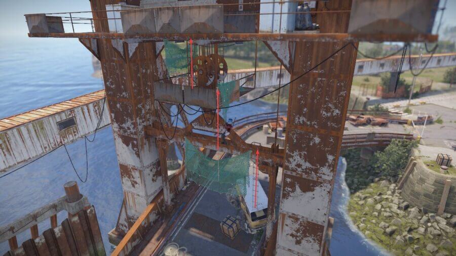 Further down the Ferry Terminal you will find the rusty tower. You can climb by following the rope ladders marked in this picture with arrows.
