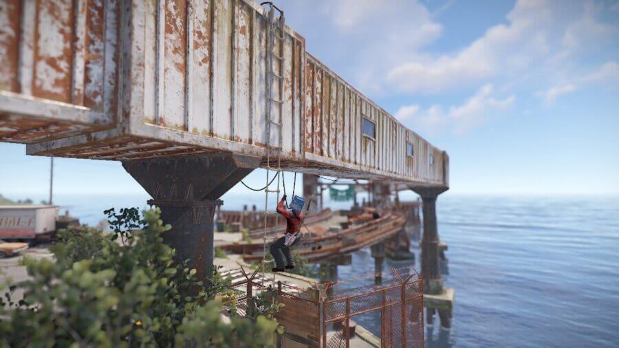 On the edge of the monument there is a discrete ladder you can climb to get on top of this elevated hallway system and can allow you to climb up the rust tower an alternative route.