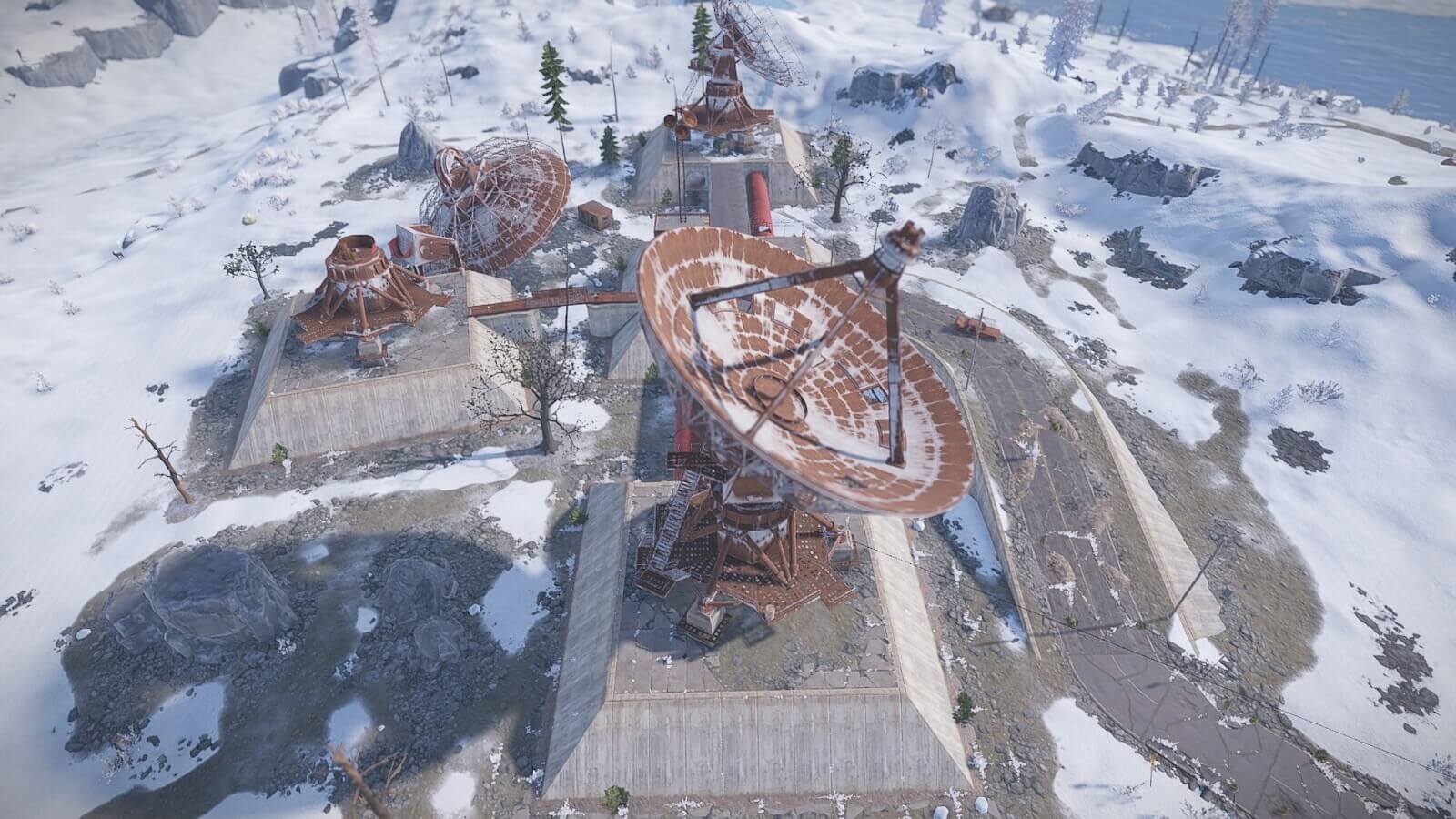 Side screenshot of the broad view of the satellite dish monument in Rust.